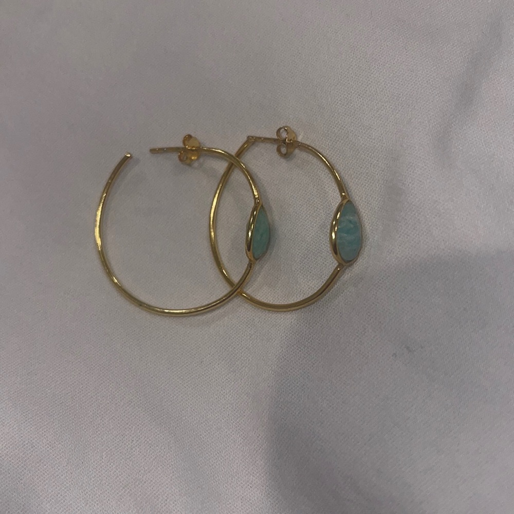 Gold hoops with blue stone